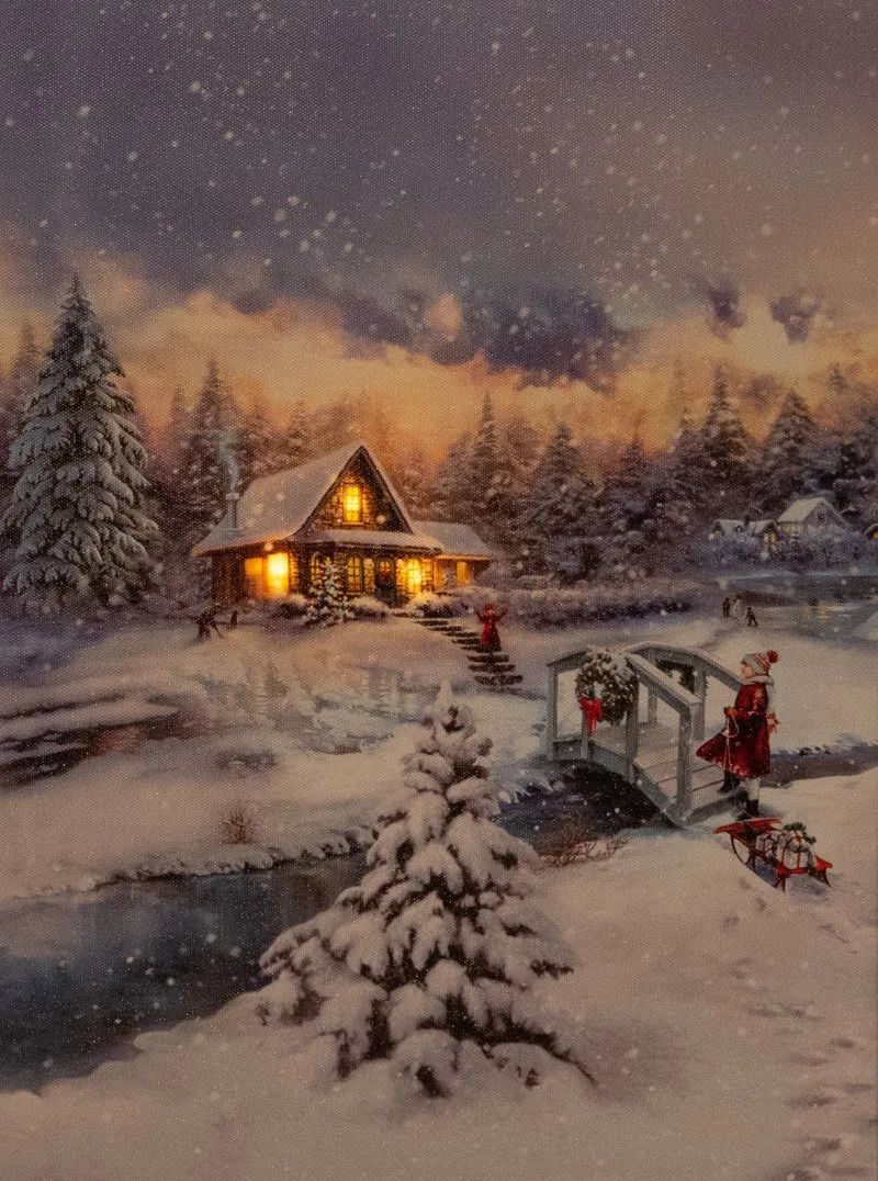 Verlichte kerstschilderij met wintertafereel, besneeuwd huis en klein meisje klein