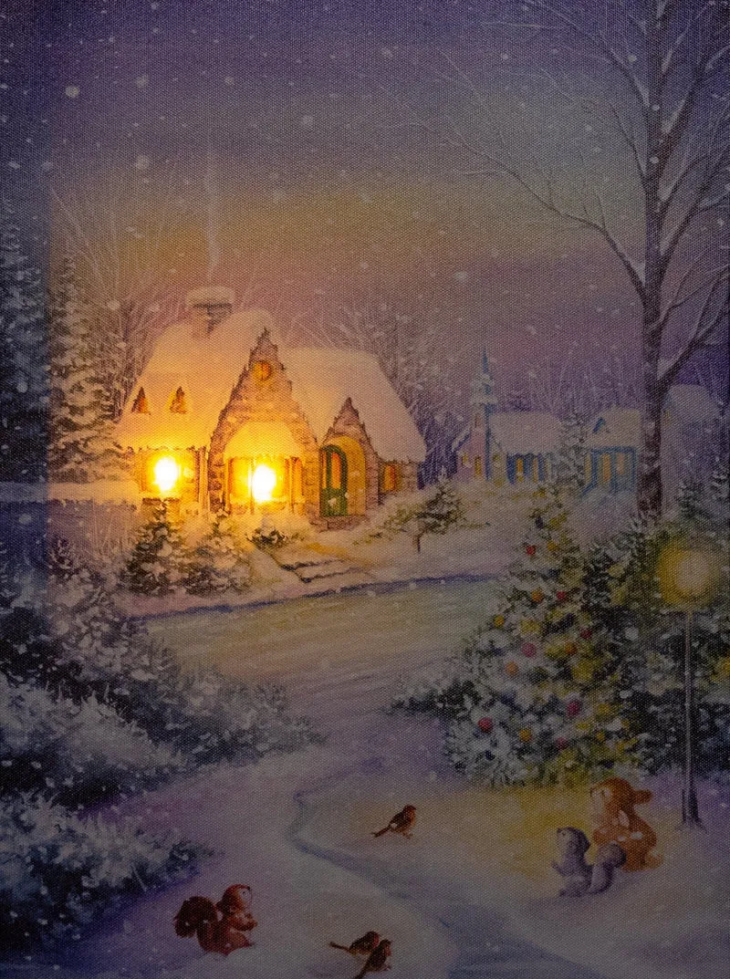 Verlichte kerstschilderij met wintertafereel en besneeuw huis klein
